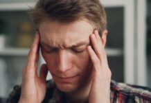 만성피로, 일상 속 작은 변화로 충분히 극복할 수 있다 a man holding his hands to his ears